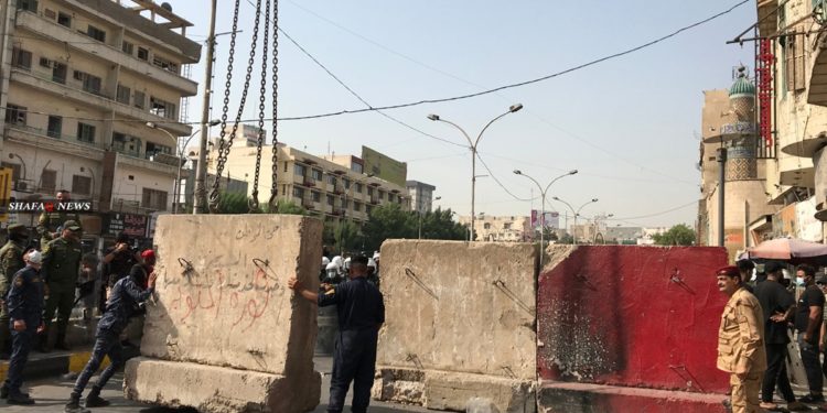 رفع الكتل الكونكريتية من شوارع بغداد , وإعادة فتح النجف أمام الزوار