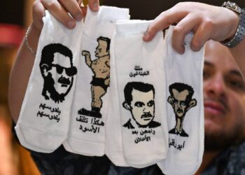 صور الأسد وعباراته تتحول مادة ساخرة على جوارب رائجة في دمشق