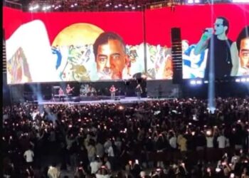 صورة لصدام بحفل فني تثير الجدل.. الأمن الوطني يحقق ويؤكد: لا تهدف لتمجيده